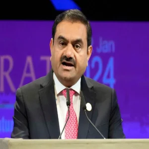 gqg sells stake in two adani companies